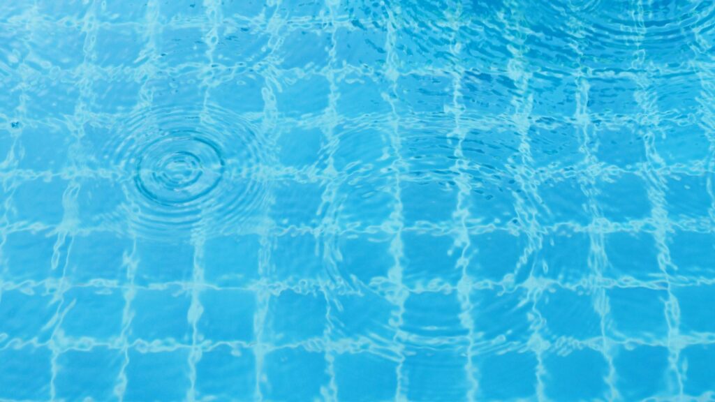 Rain drops on the swimming pool.